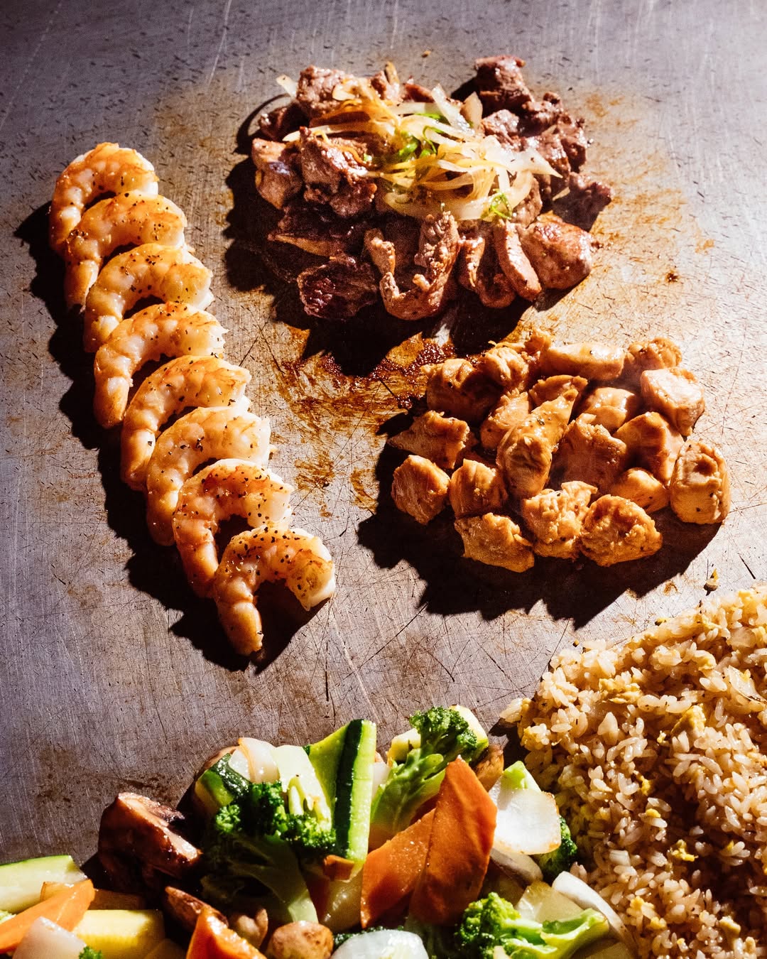 Hibachi chef cooking with flames